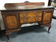 A Victorian mahogany glass topped sideboard on claw and ball feet