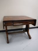 A 19th century mahogany flap-sided table fitted a drawer