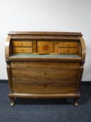 A 19th century continental mahogany barrel front bureau