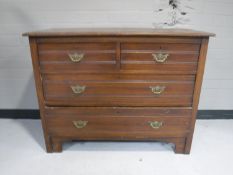An Edwardian pine four drawer chest