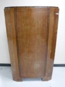 An early 20th century mahogany corner cabinet