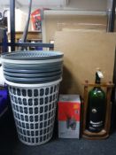 A Chianti wine bottle on pouring stand together with a boxed belt sander,