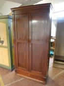 A 19th century inlaid mahogany double door cupboard fitted a drawer (locked and without a key)