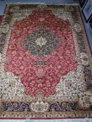A fringed Keshan rug,