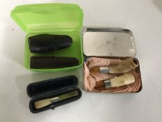 Five cheroots including one with silver mount