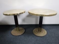 Two circular brass topped pub tables