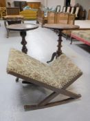 A gout stool and two pedestal wine tables