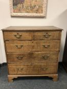 A George III oak chest on bracket feet, 95 cm.