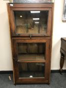 An Eastern hardwood display cabinet with lift front door,