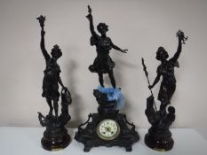 A three piece French spelter clock garniture