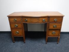 A Regency style writing desk fitted seven drawers