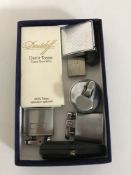 A box of assorted lighters together with a bullet casing