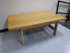 A contemporary beech coffee table