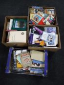 Four boxes of hardback and paperback books including Western novels, reference,