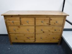 A contemporary pine eight drawer chest