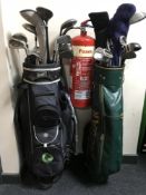 Two golf bags containing assorted drivers and irons