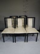 A set of five black high gloss and leather dining chairs designed by Van Dal