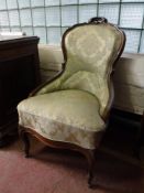 A Victorian mahogany lady's chair in gold fabric