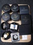 A tray of eleven lady's and gent's Claude Valentini wristwatches
