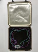 A very fine quality tutti-fruiti necklace comprising three strands of ruby,