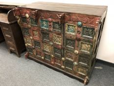 A multi drawer cabinet with painted decoration, width 122 cm.
