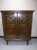 A continental oak linen fold sideboard