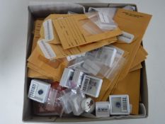 A box of authentic and simulated gemstones