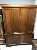 A hardwood double door linen cupboard CONDITION REPORT: 190cm by 132cm by 63cm.