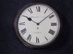 A mahogany cased circular wall clock with chain-driven single fusee movement,