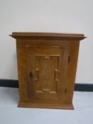 An oak wall cabinet