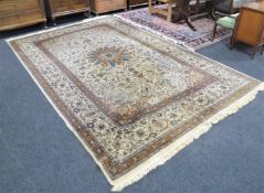A Tabriz design carpet on cream ground