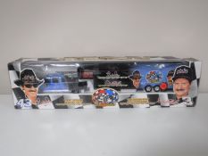 A boxed Brookfield Collector's Guild Dale Earnhardt & Richard Petty crew cab pickup and trailer