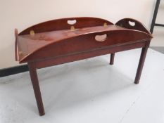 A mahogany butler's tray on stand