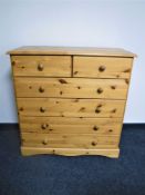 A contemporary pine six drawer chest