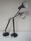 A pair of mid twentieth century angle poise lamps on circular bases