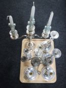 A tray containing two silver plated candelabrum together with three pairs of silver plated