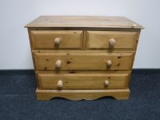 A pine four drawer chest