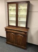 A Victorian and later mahogany display cabinet with Fry's Milk Chocolate advertising,