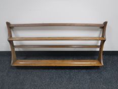 An Ercol elm plate rack