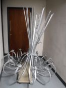 A bespoke twelve branch metal light fitting,