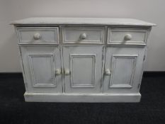 A painted pine triple door sideboard CONDITION REPORT: This measures 82cm high,