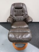A brown leather swivel relaxer armchair and stool