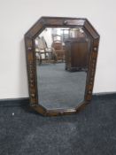 An early 20th century oak framed mirror