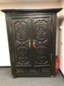 An antique Eastern hardwood double door cabinet,
