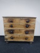 A Victorian pine five drawer chest