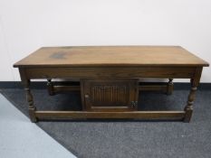 An Old Charm coffee table fitted a cupboard and a pair of bar stools