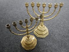 Two brass menorahs