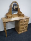 A pine four drawer dressing table with Ducal Pine mirror