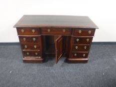 A Victorian mahogany leather topped writing desk