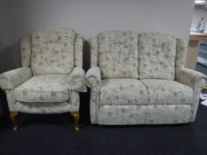 A contemporary two seater settee and armchair in floral fabric